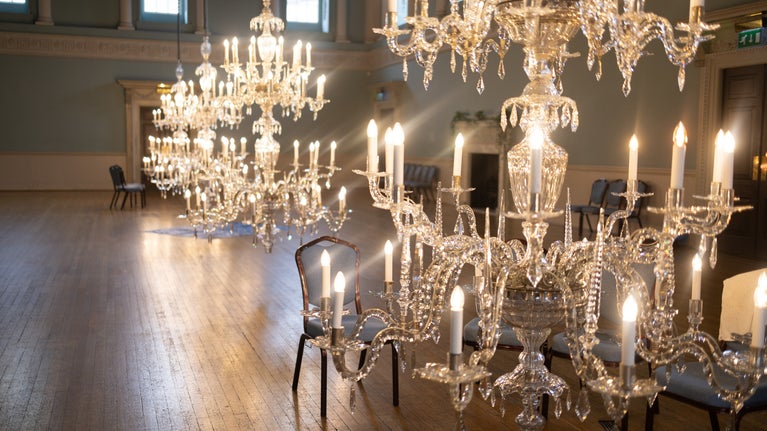 Chandeliers in the Ball Room lowered to floor level for cleaning with all the bulbs on.